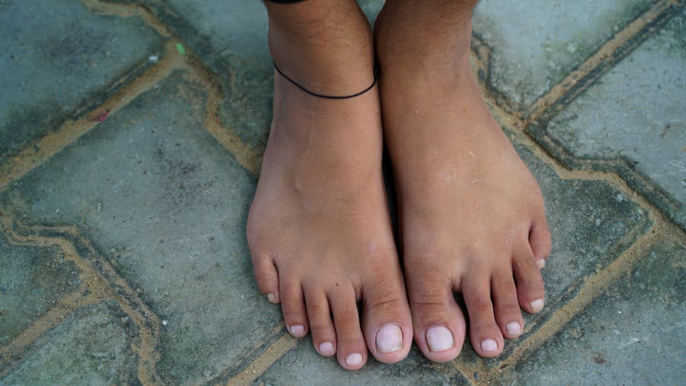 Why Do So Many People Wear a Black Thread on Their Leg?